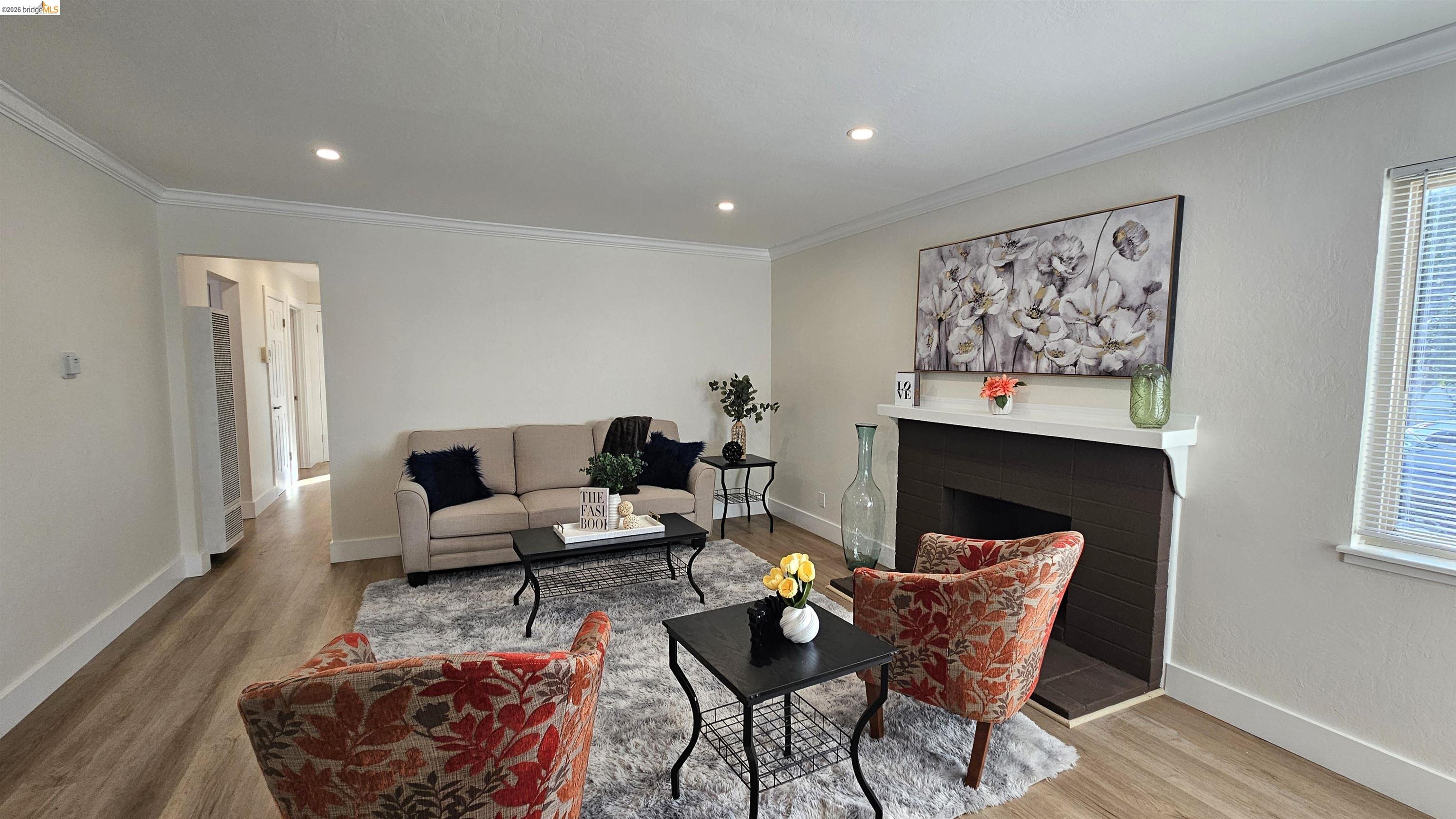 95 West Leland Road Pittsburg, CA 94565 - Photo 5 of 25 a living room with furniture and a fireplace