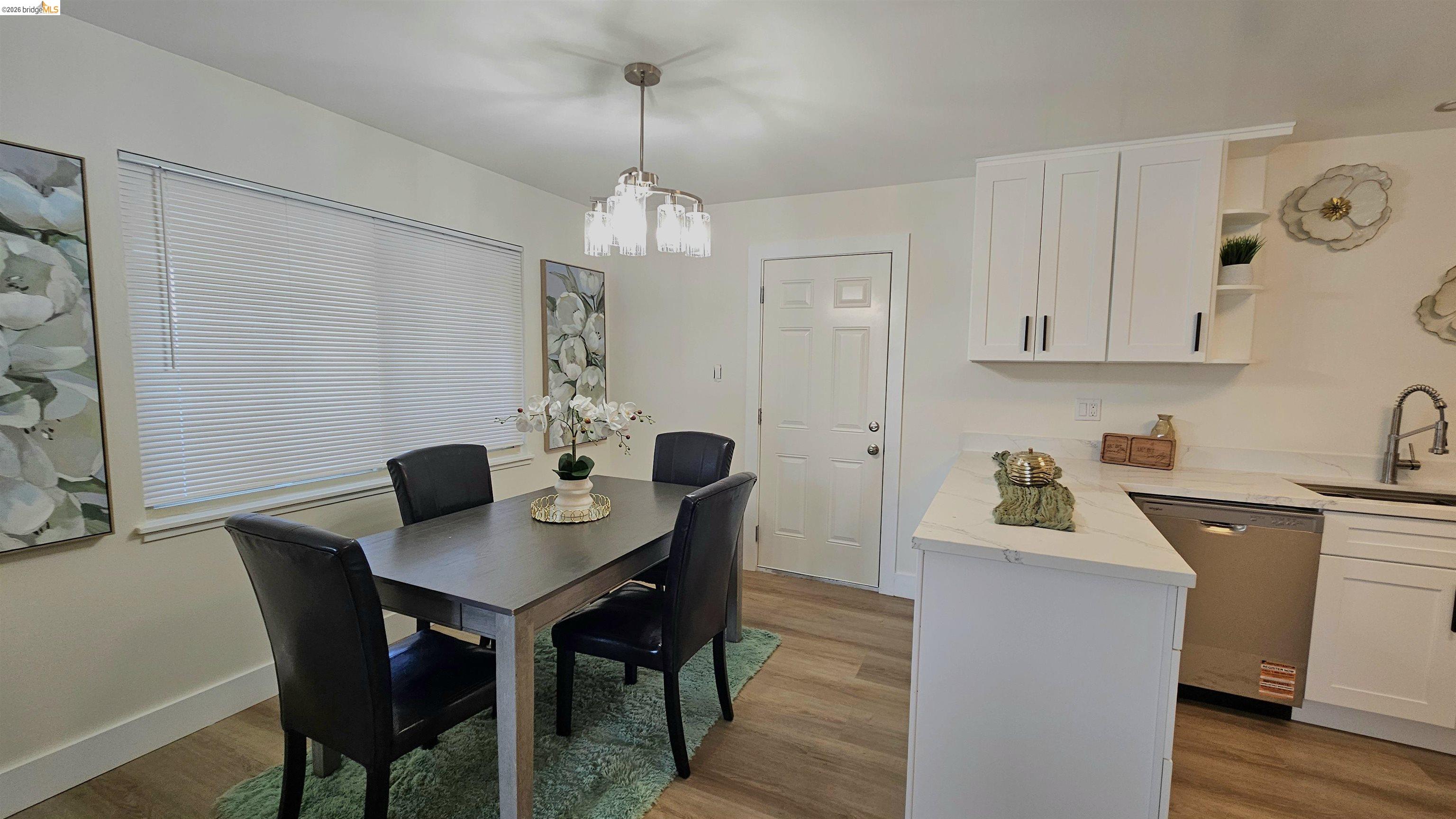 95 West Leland Road Pittsburg, CA 94565 - Photo 9 of 25 a view of a dining room with furniture and wooden floor