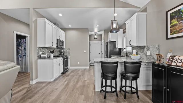 a bathroom with a sink a vanity and a mirror