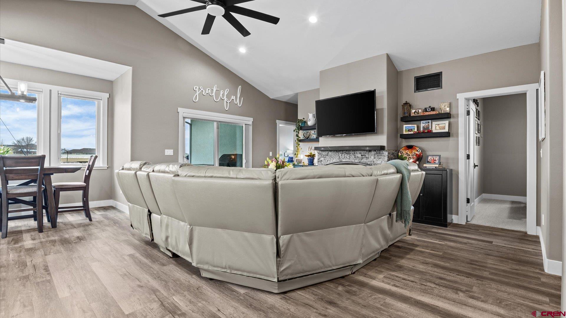 67190 Sunnyside Road Montrose, CO 81401 - Photo 17 of 41 a living room with furniture and a flat screen tv