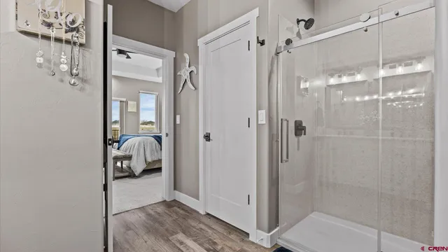 a view of a terrace with wooden floor and a ocean view