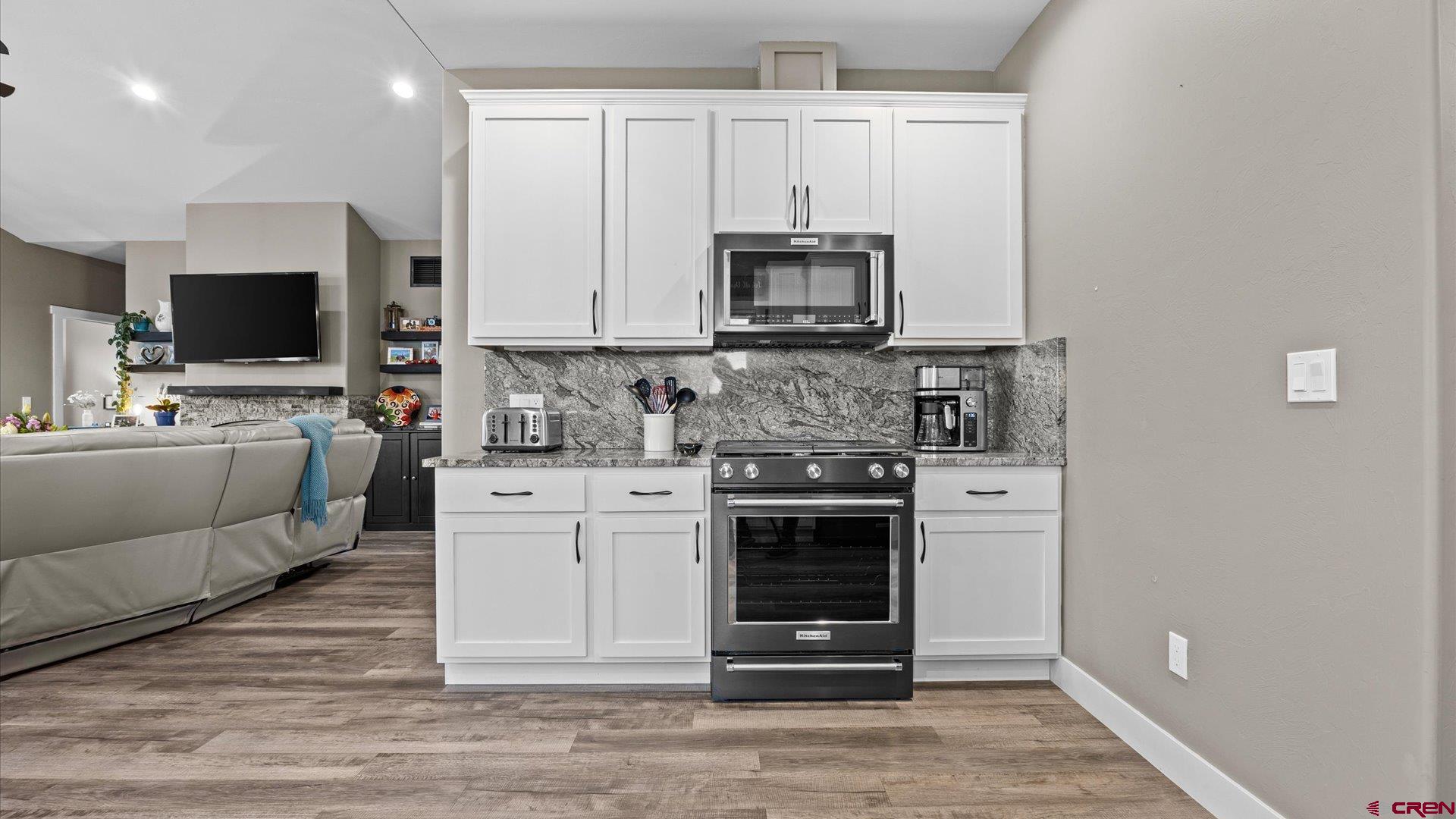 67190 Sunnyside Road Montrose, CO 81401 - Photo 22 of 41 a kitchen with stainless steel appliances a stove microwave and refrigerator