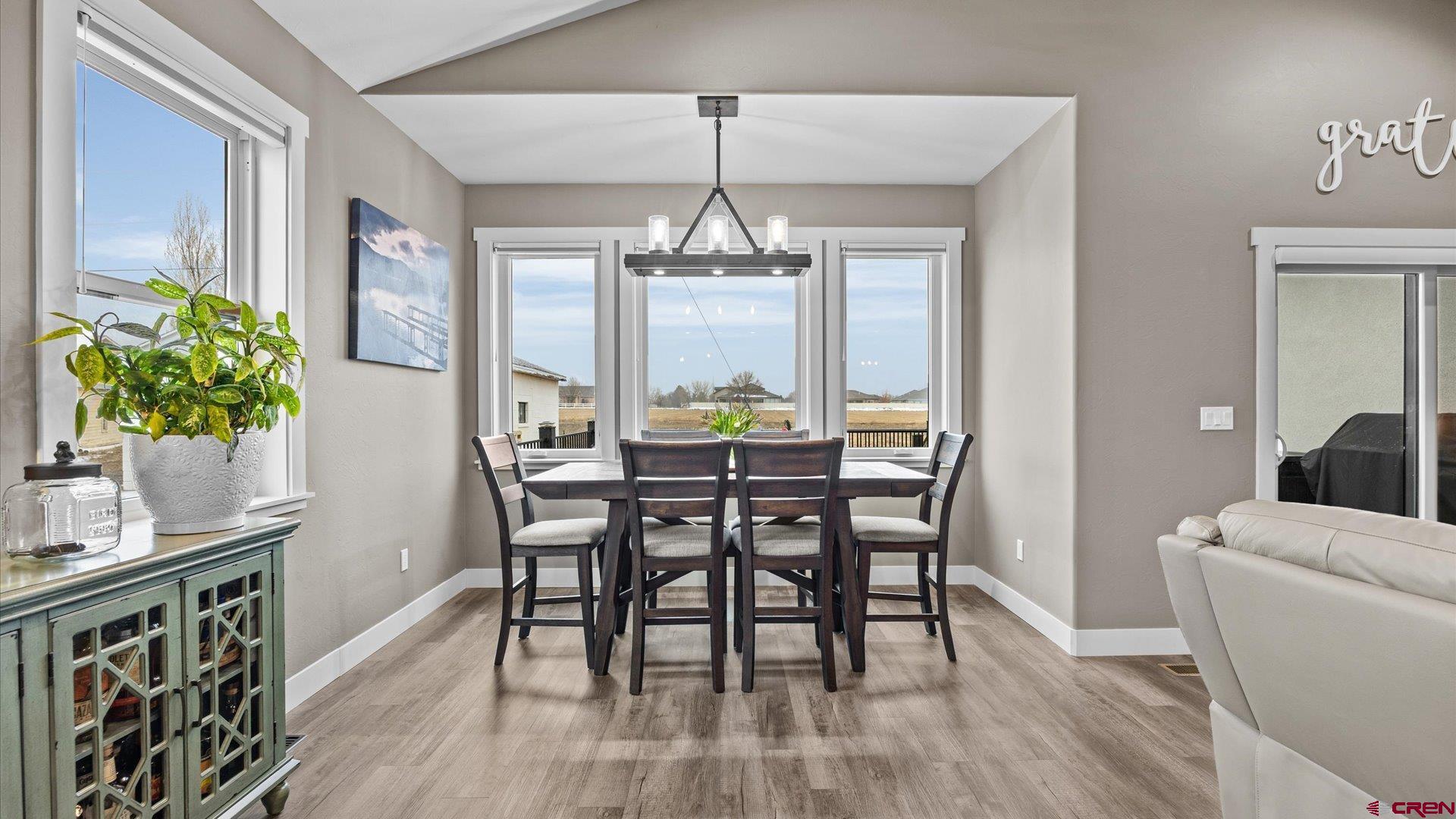 67190 Sunnyside Road Montrose, CO 81401 - Photo 23 of 41 a view of a dining room with furniture window and wooden floor