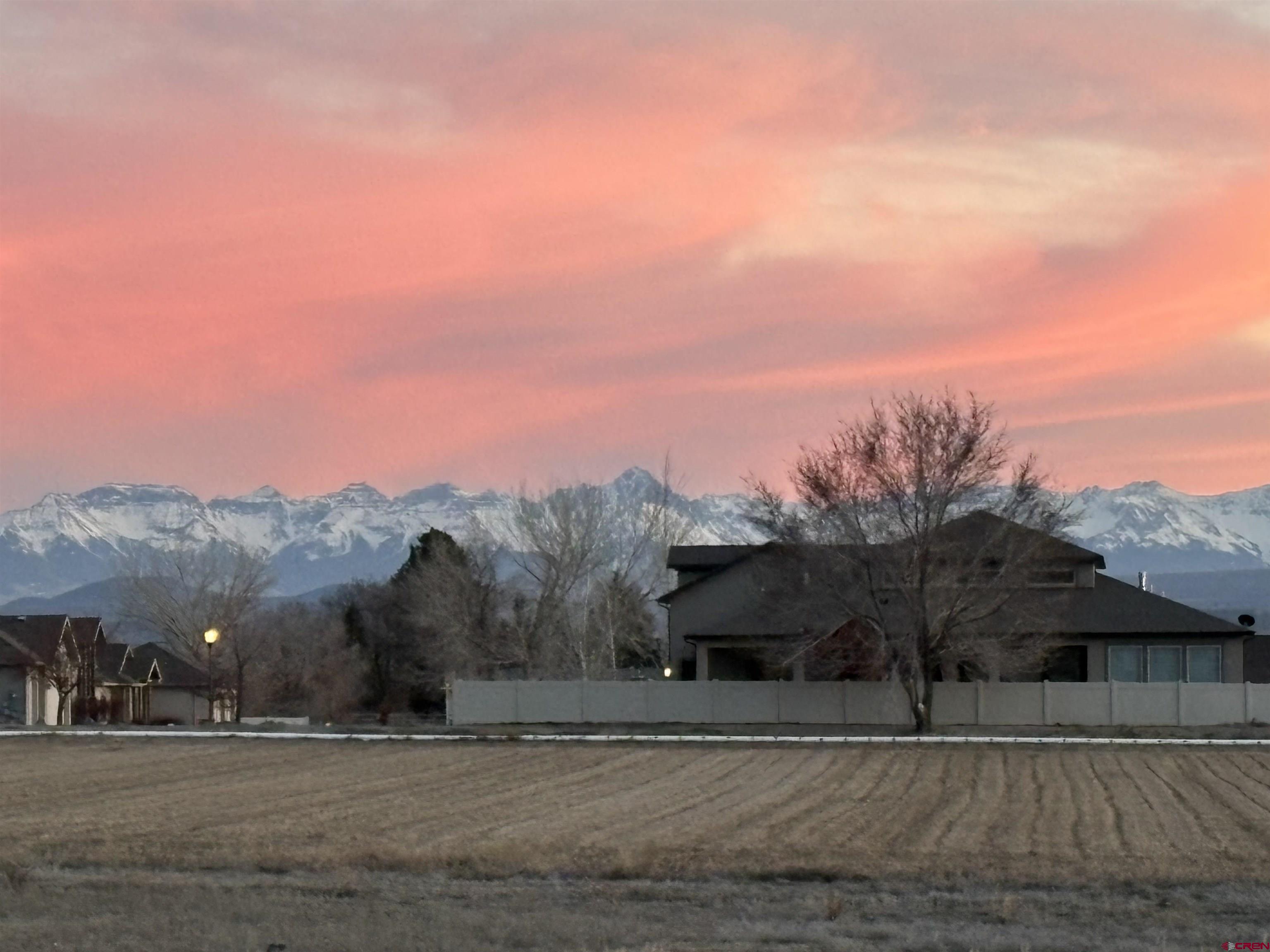 67190 Sunnyside Road Montrose, CO 81401 - Photo 3 of 41 a view of a town with mountains in the background