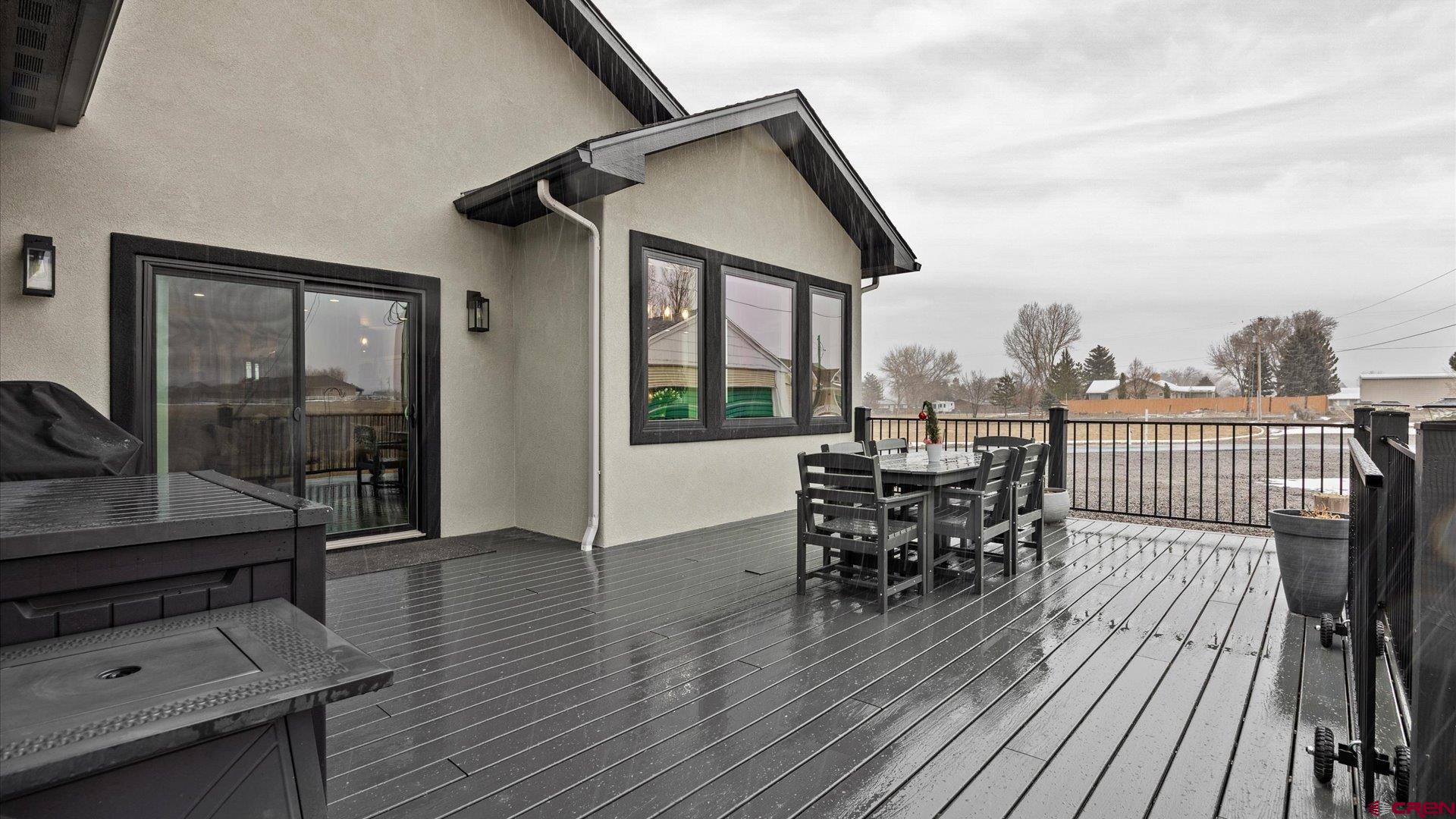67190 Sunnyside Road Montrose, CO 81401 - Photo 31 of 41 a balcony with wooden floor table and chairs