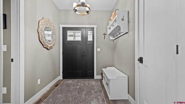 a kitchen with stainless steel appliances a stove microwave and refrigerator