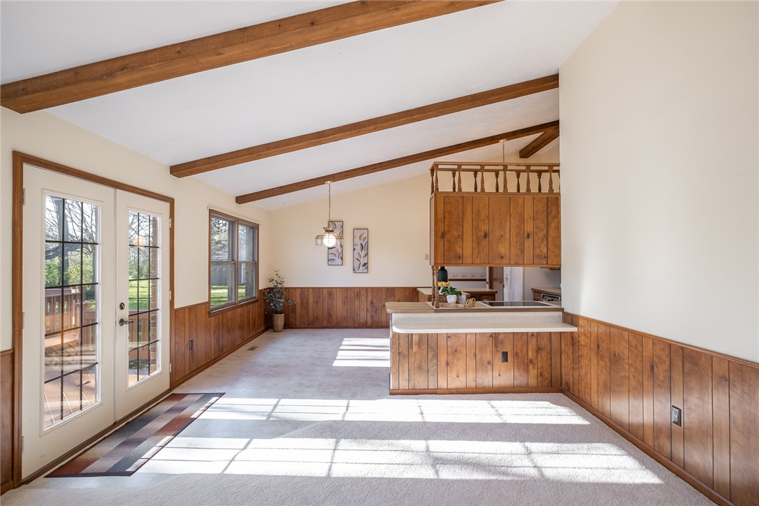 276 South Fairfield Road Bellbrook, OH 45305 - Photo 18 of 38 Bright, spacious living area with vaulted ceilings and wood accents welcomes natural light.