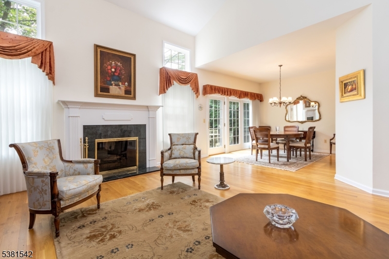 12 Hurlingham Club Road Far Hills, NJ 07931 - Photo 11 of 31 a living room with furniture and a fireplace
