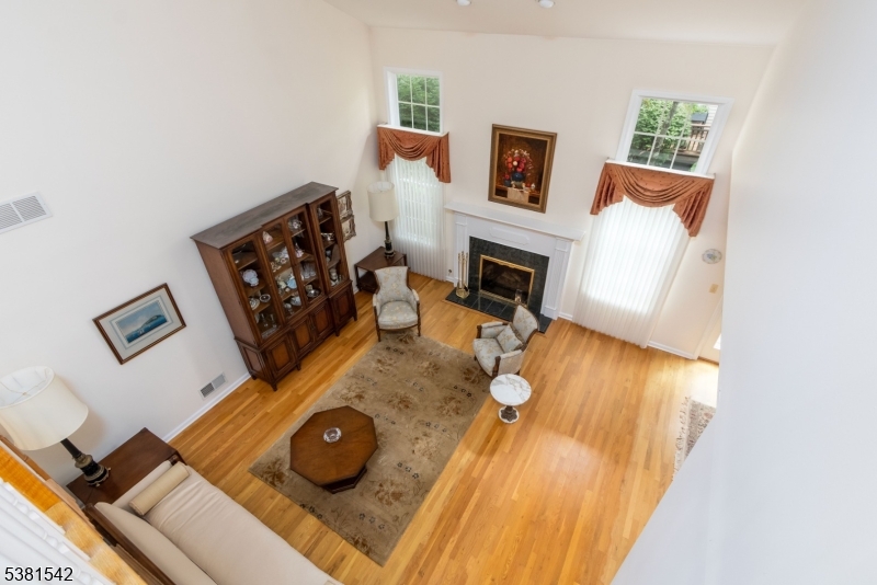 12 Hurlingham Club Road Far Hills, NJ 07931 - Photo 24 of 31 a living room with furniture and a fireplace