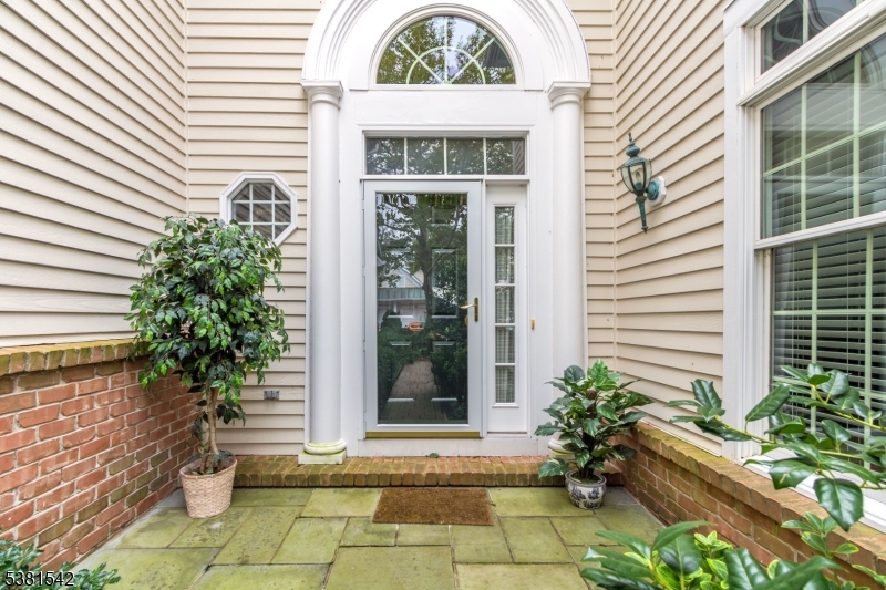 12 Hurlingham Club Road Far Hills, NJ 07931 - Photo 3 of 31 a view of a entrance door of the house