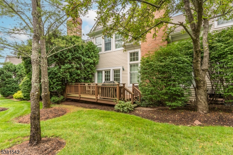 12 Hurlingham Club Road Far Hills, NJ 07931 - Photo 31 of 31 a view of a house with a backyard and a patio