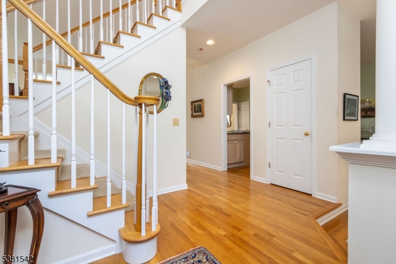 12 Hurlingham Club Road Far Hills, NJ 07931 - Photo 5 of 31 a view of an entryway with wooden floor and door