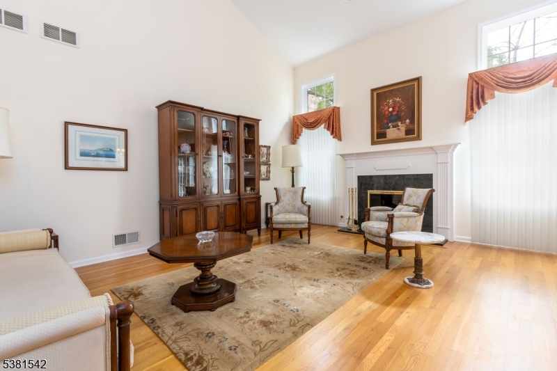 12 Hurlingham Club Road Far Hills, NJ 07931 - Photo 9 of 31 a living room with furniture and a fireplace