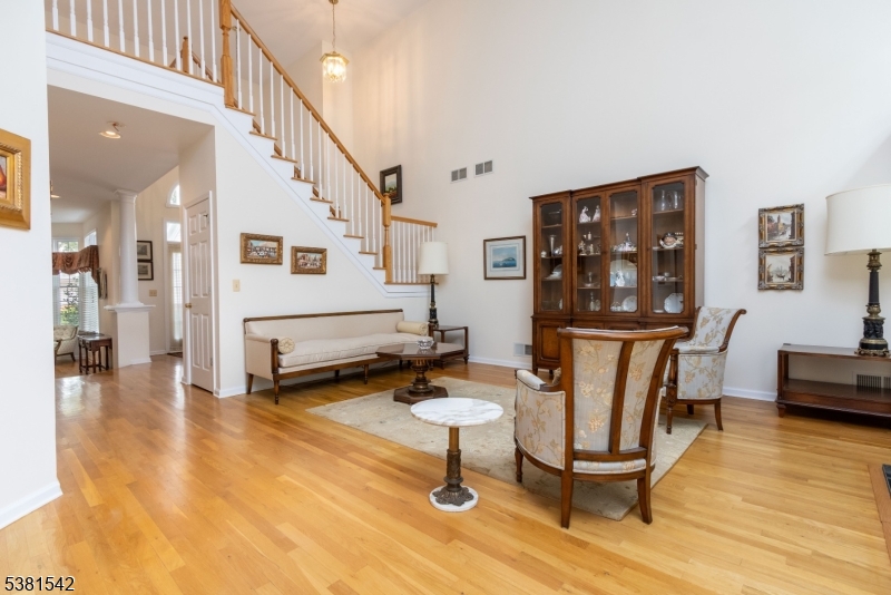 12 Hurlingham Club Road Far Hills, NJ 07931 - Photo 10 of 31 a living room with furniture and a table