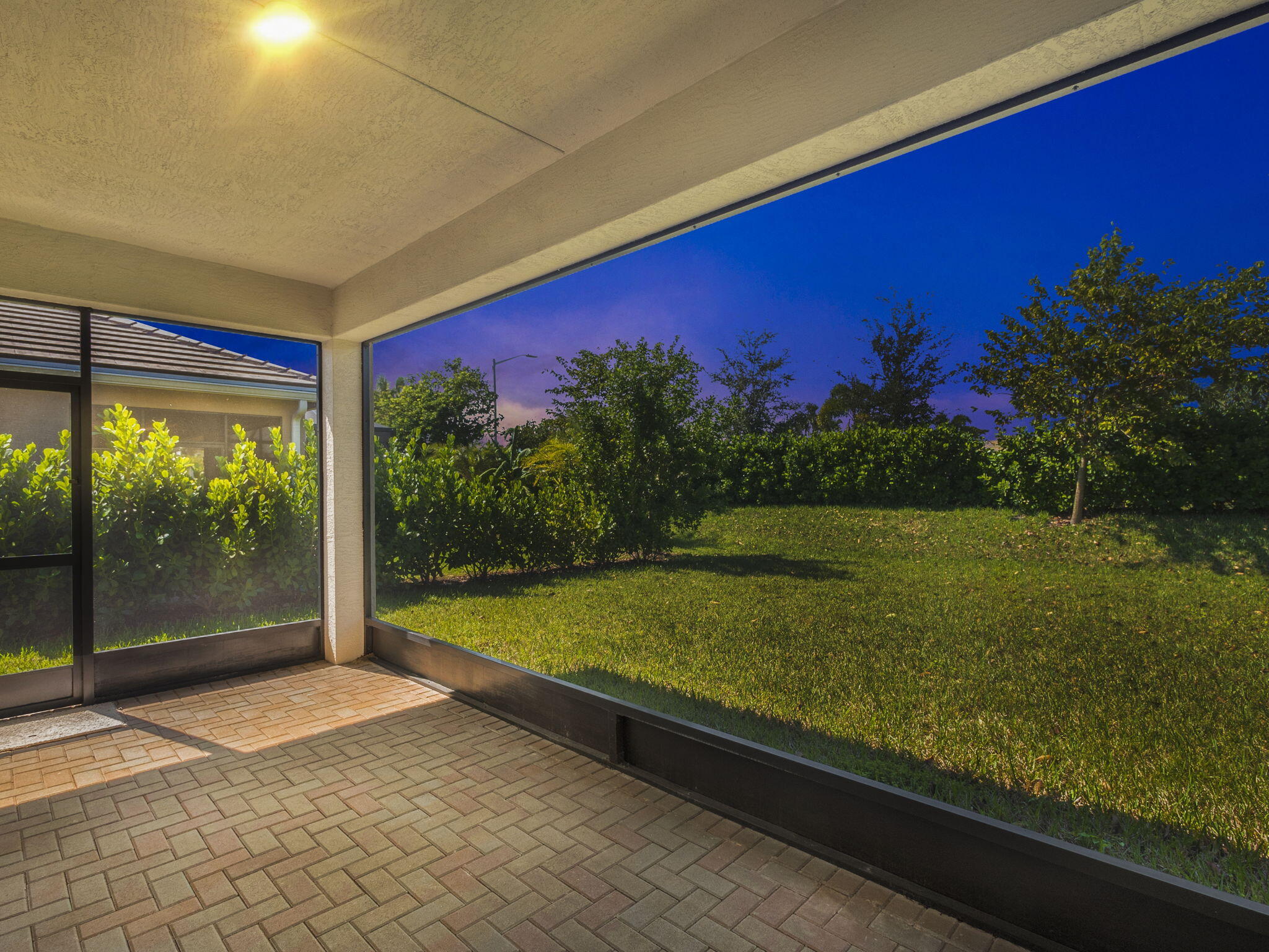 13459 Southwest Green Delta Road Port St. Lucie, FL 34987 - Photo 23 of 100 Lanai Night Shot