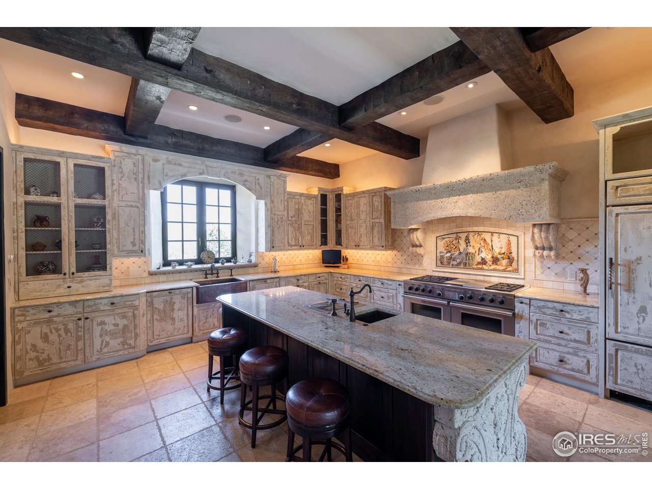 9200 Old Flowers Road Bellvue, CO 80512 - Photo 19 of 50 a kitchen with a stove a sink and a refrigerator