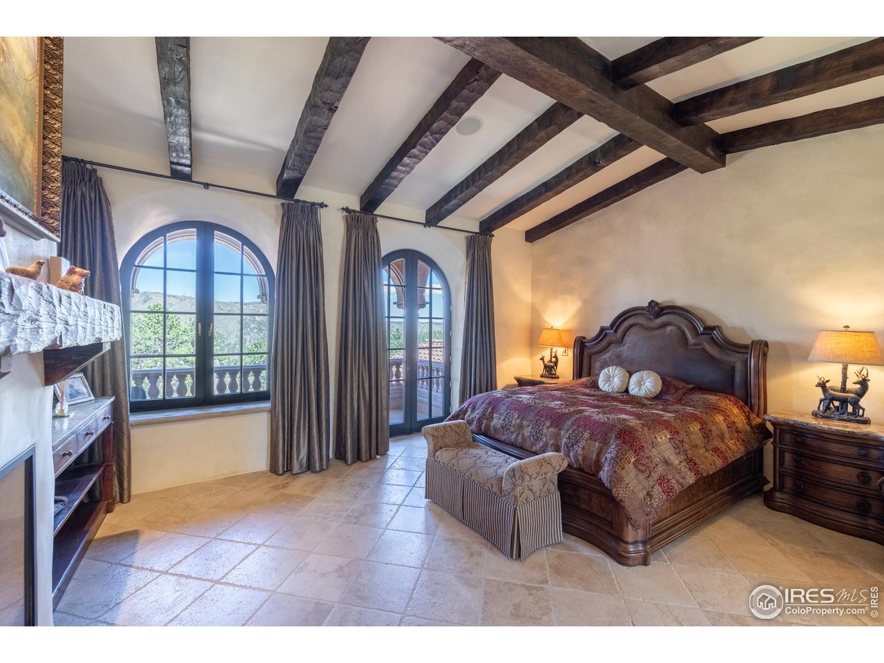 9200 Old Flowers Road Bellvue, CO 80512 - Photo 31 of 50 a bed room with a bed and a large window