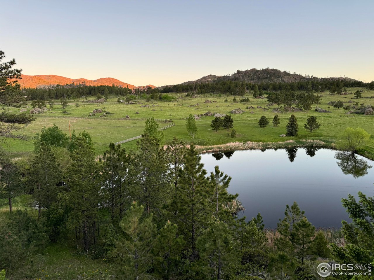 9200 Old Flowers Road Bellvue, CO 80512 - Photo 5 of 50 a view of a lake with a mountain in the background