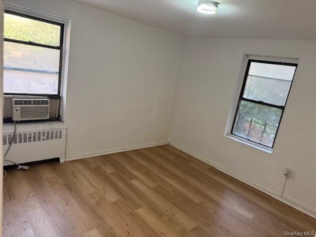 44-16 Macnish Street, Unit 1C Queens, NY 11373 - Photo 2 of 8 an empty room with windows