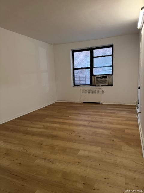 44-16 Macnish Street, Unit 1C Queens, NY 11373 - Photo 4 of 8 a view of an empty room with a window