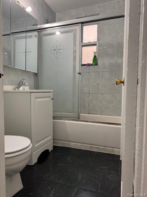 44-16 Macnish Street, Unit 1C Queens, NY 11373 - Photo 8 of 8 a bathroom with a sink a toilet and shower