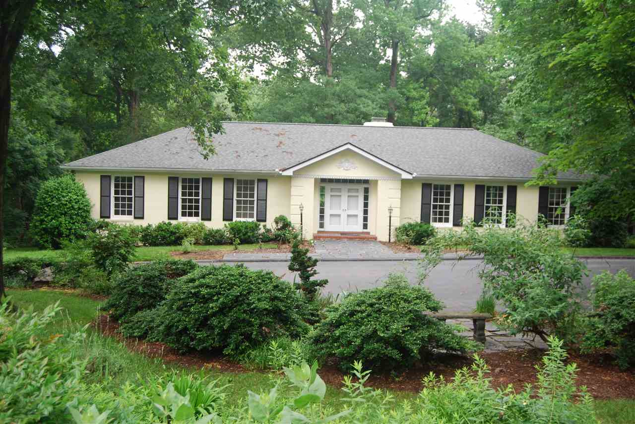 3626 Hathaway Road Durham, NC 27707 - Photo 1 of 4 a front view of a house with a yard and green space