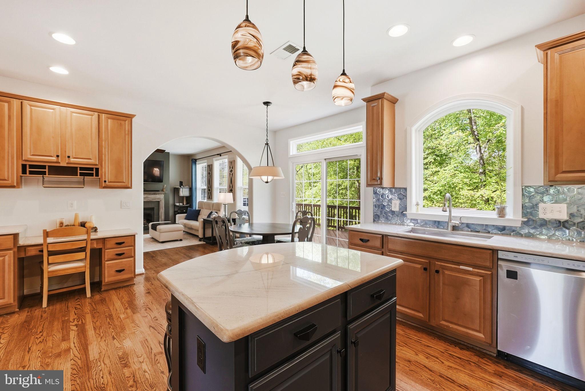 8315 Shimmering Rock Road Gainesville, VA 20155 - Photo 10 of 49 Kitchen with Quartz Island