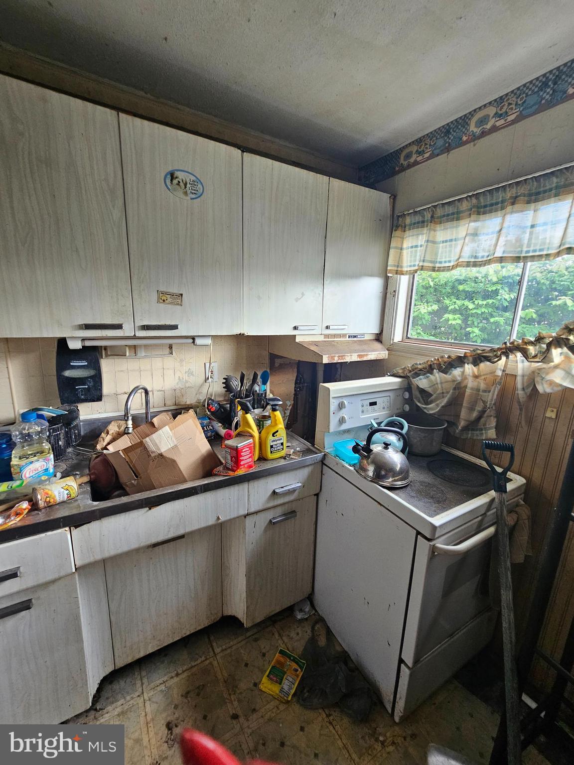 139 Ivy Hill Road Levittown, PA 19057 - Photo 12 of 30 a kitchen with stainless steel appliances a sink a stove and white cabinets