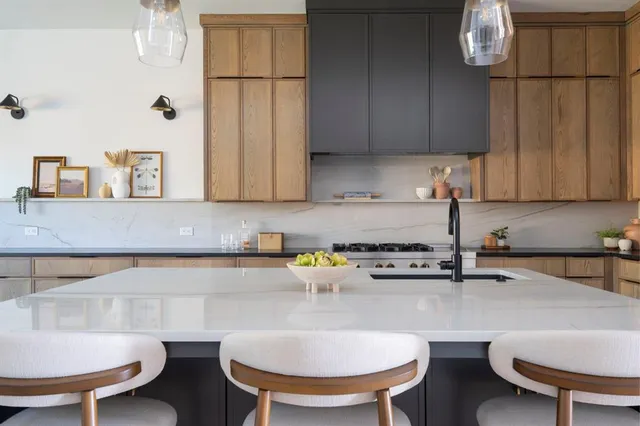 a kitchen with furniture a sink and appliances