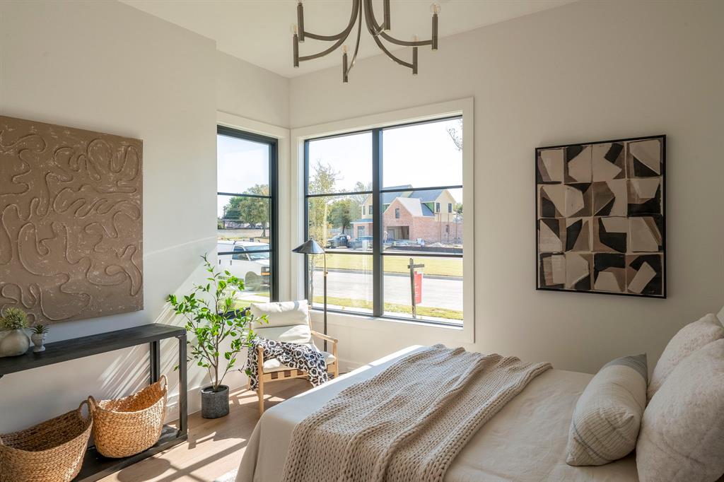 2971 Kosse Court Grapevine, TX 76051 - Photo 25 of 39 a bedroom with a bed and a potted plant