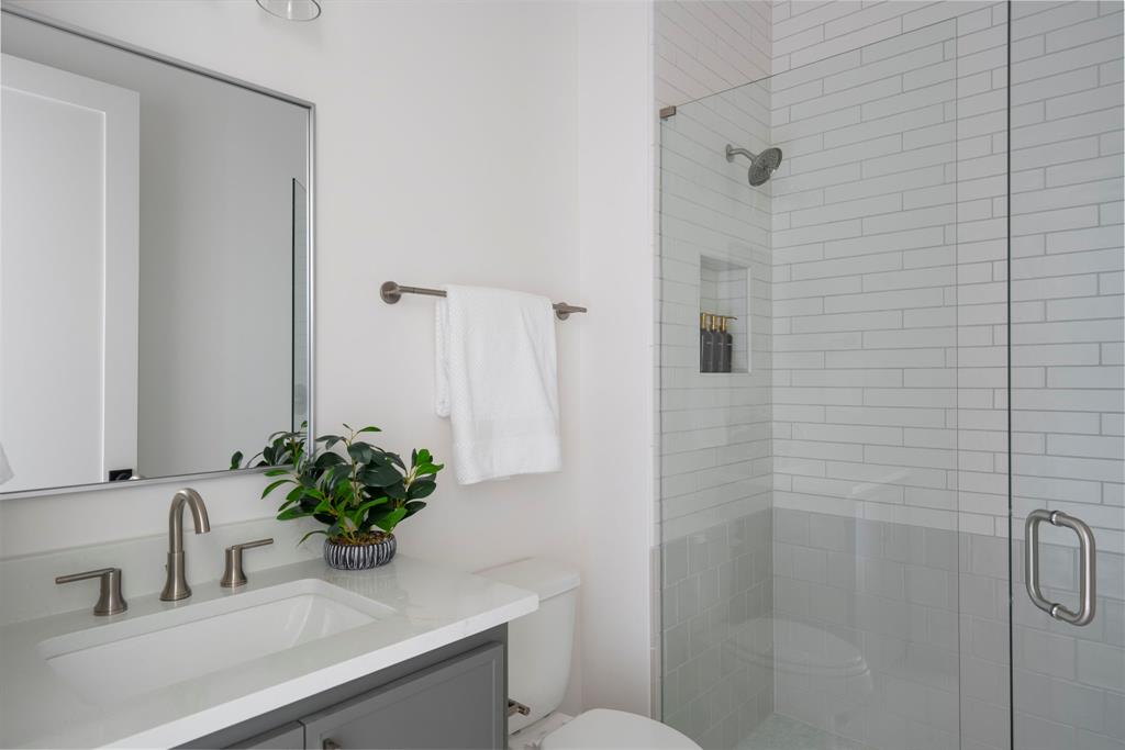 2971 Kosse Court Grapevine, TX 76051 - Photo 27 of 39 a bathroom with a sink a toilet and shower