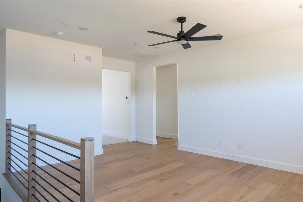 2971 Kosse Court Grapevine, TX 76051 - Photo 28 of 39 a view of room with wooden floor and a ceiling fan