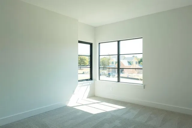 an empty room with windows
