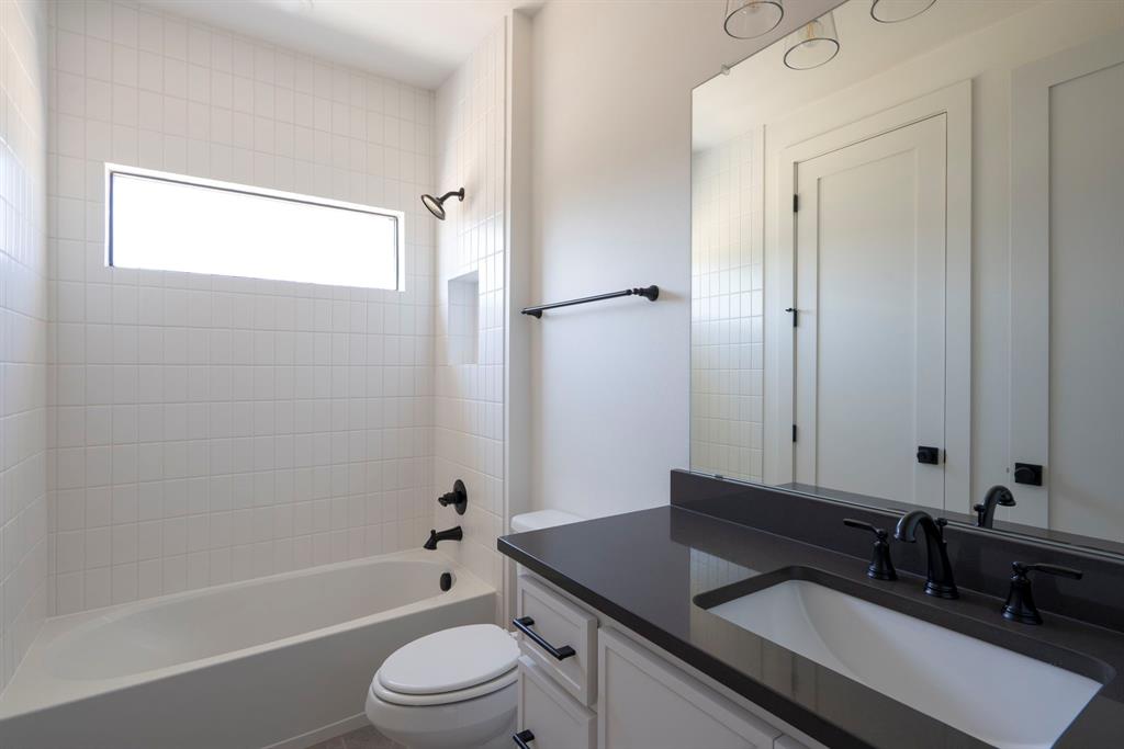 2971 Kosse Court Grapevine, TX 76051 - Photo 34 of 39 a bathroom with a granite countertop sink toilet and shower