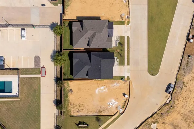 an aerial view of a house with outdoor space