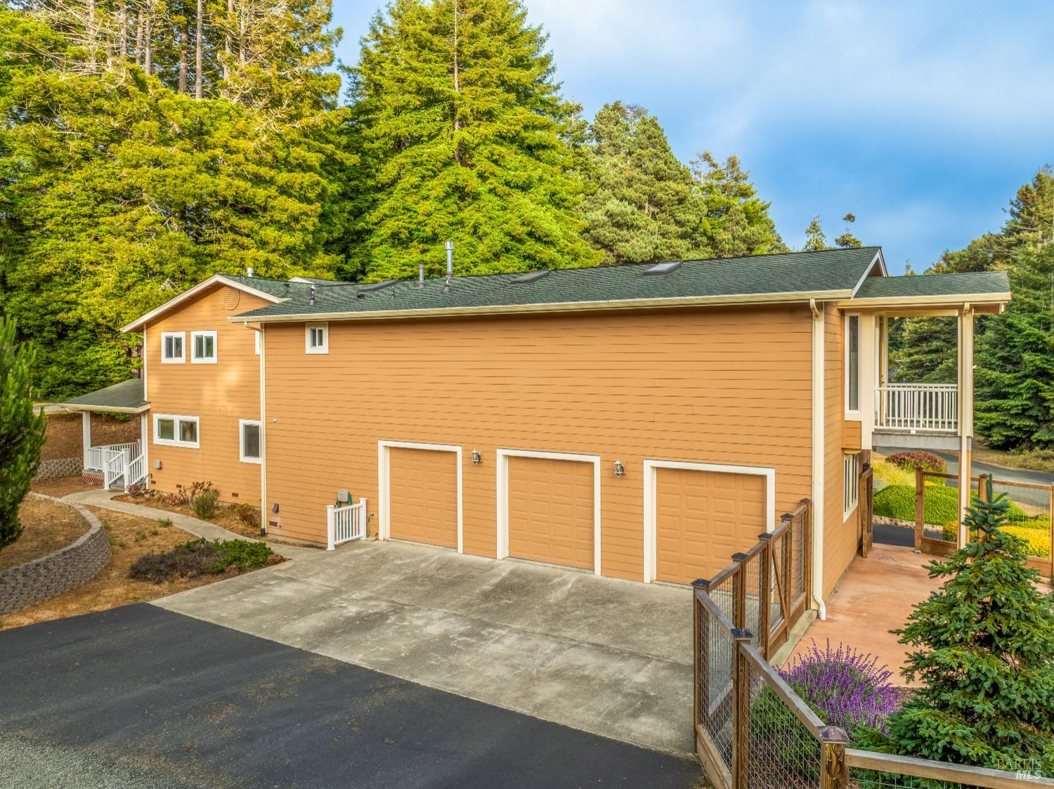16611 Pearl Ranch Road Fort Bragg, CA 95437 - Photo 54 of 71 a front view of a house with a yard and garage