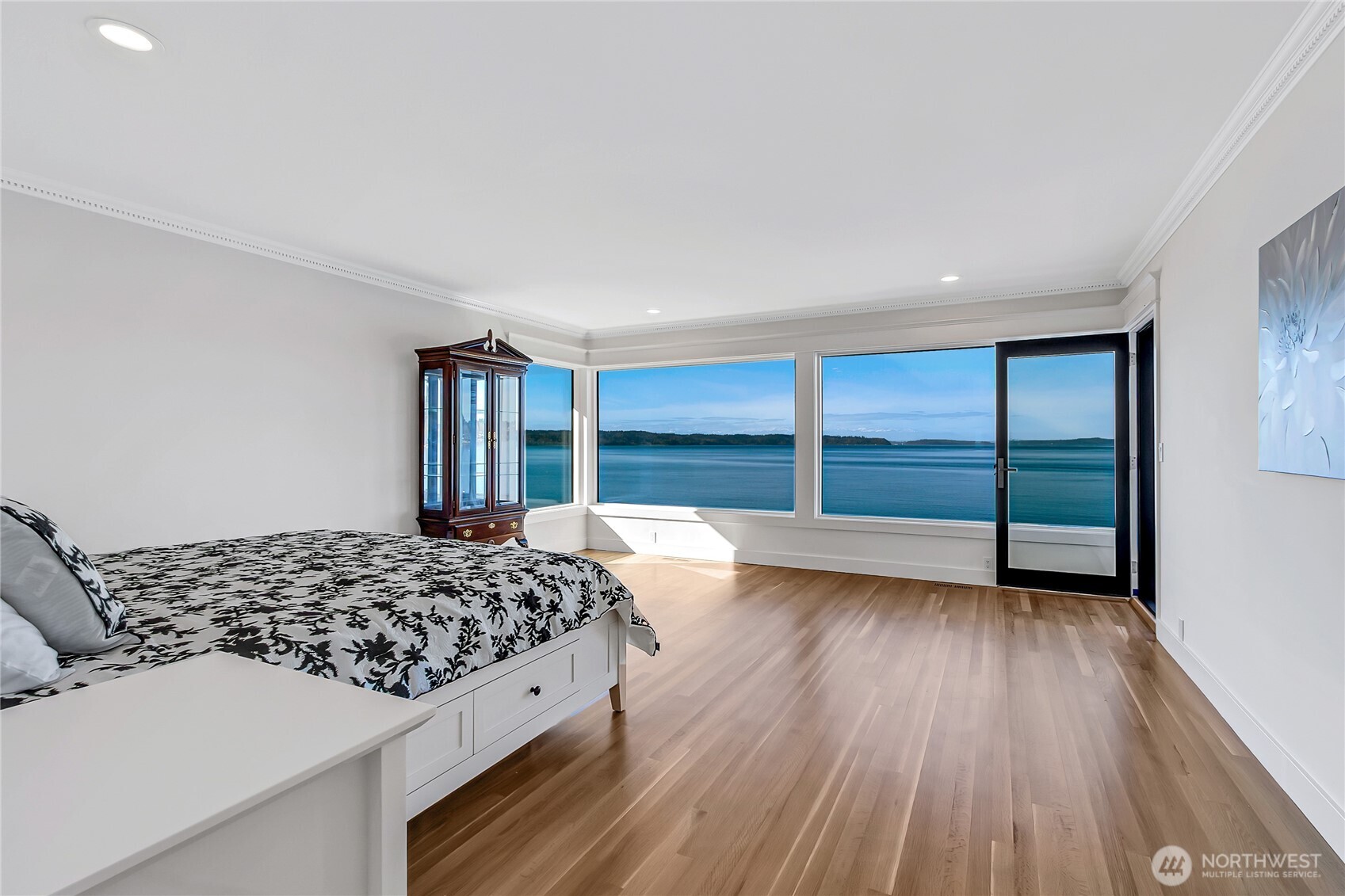 16331 Maplewild Avenue Southwest Burien, WA 98166 - Photo 13 of 31 a bedroom with a bed and a large window