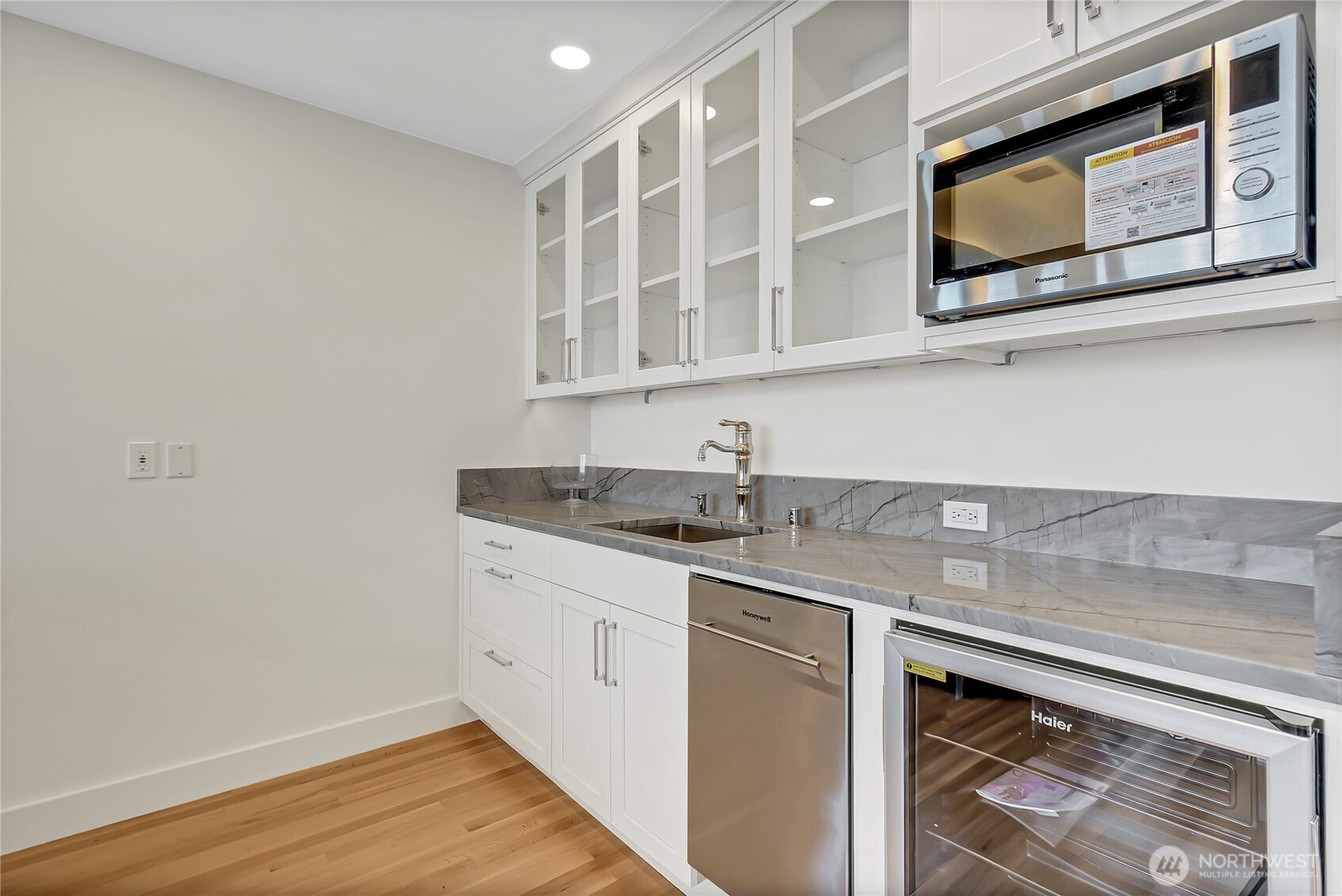 16331 Maplewild Avenue Southwest Burien, WA 98166 - Photo 17 of 31 a kitchen with stainless steel appliances granite countertop a sink and a microwave oven