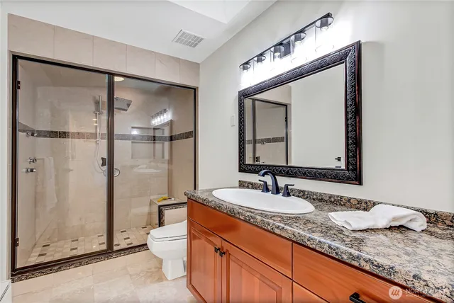 a bed room with a bed and a chair