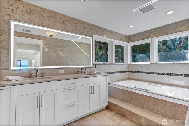 a bathroom with a shower and a sink