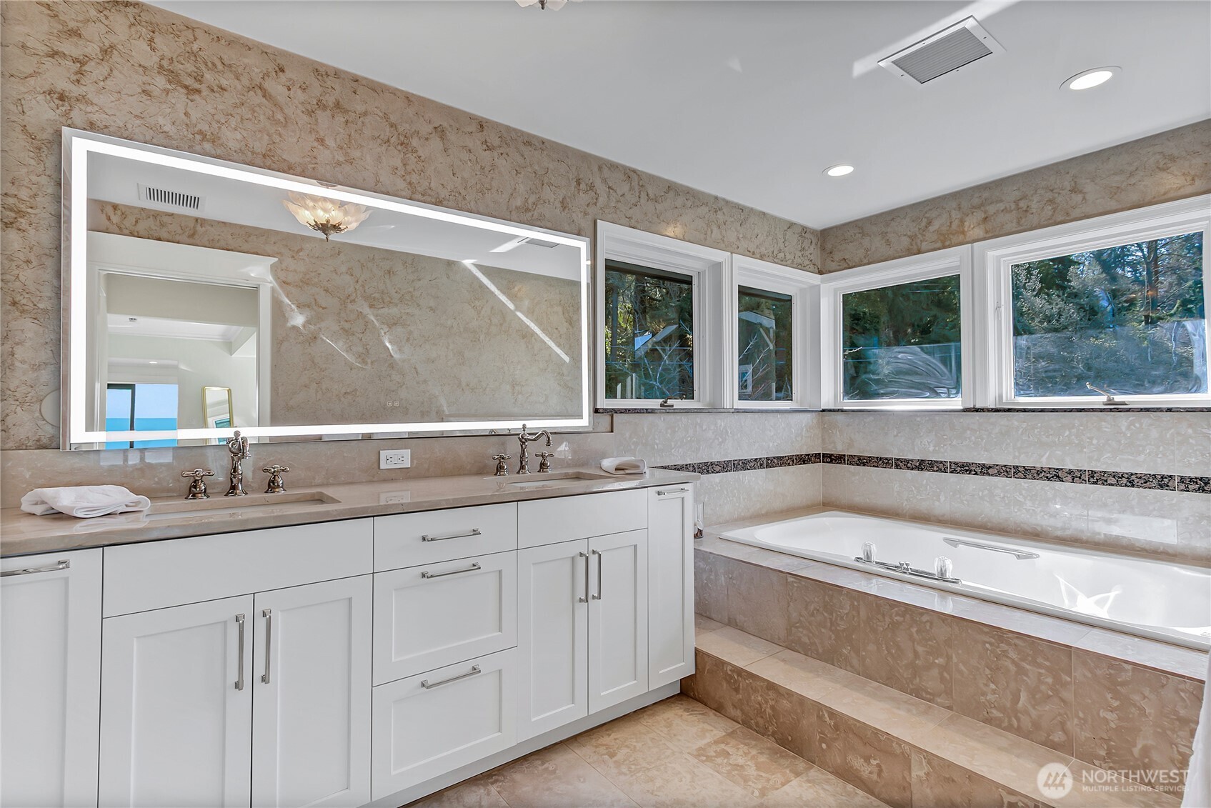 16331 Maplewild Avenue Southwest Burien, WA 98166 - Photo 24 of 31 a bathroom with a sink and a large mirror next to a window
