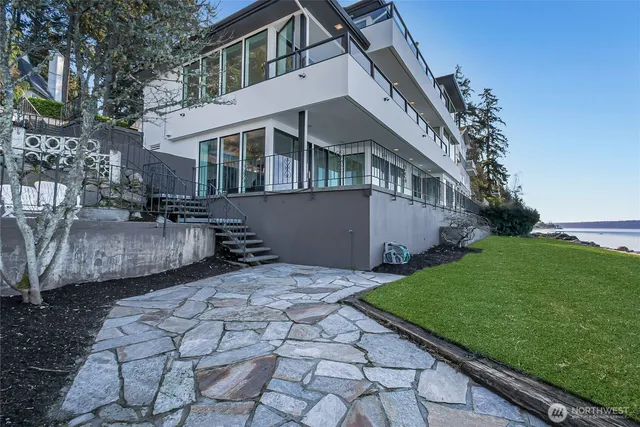 a view of a house with a garden and pathway