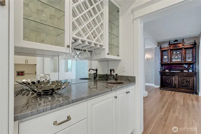 a kitchen with stainless steel appliances kitchen island granite countertop a sink and cabinets