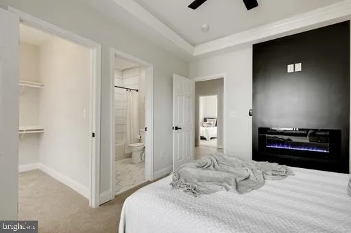 a bedroom with a bed and a television