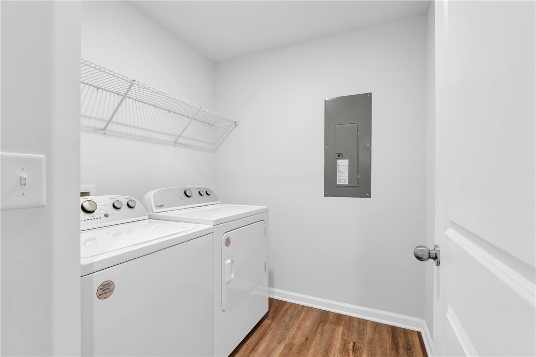 8 Leander Drive Greer, SC 29651 - Photo 27 of 31 Functional utility space with durable flooring offers convenient laundry facilities.