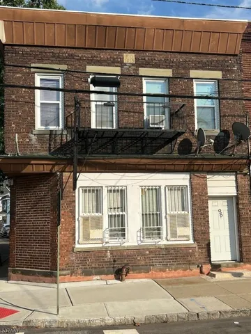 a kitchen with stainless steel appliances a stove a sink and a refrigerator