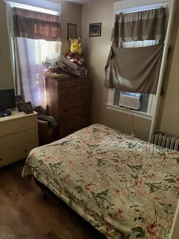 a view of a livingroom with furniture and a flat screen tv