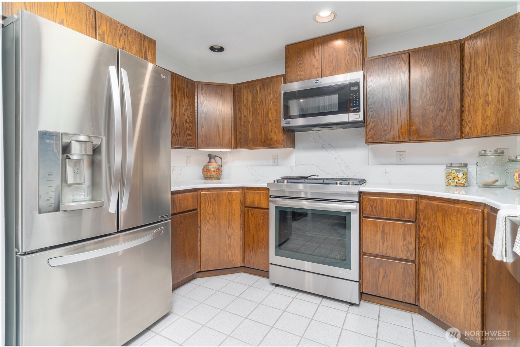2102 Mark Street Northeast Olympia, WA 98516 - Photo 14 of 37 a kitchen with stainless steel appliances granite countertop a refrigerator and a stove top oven