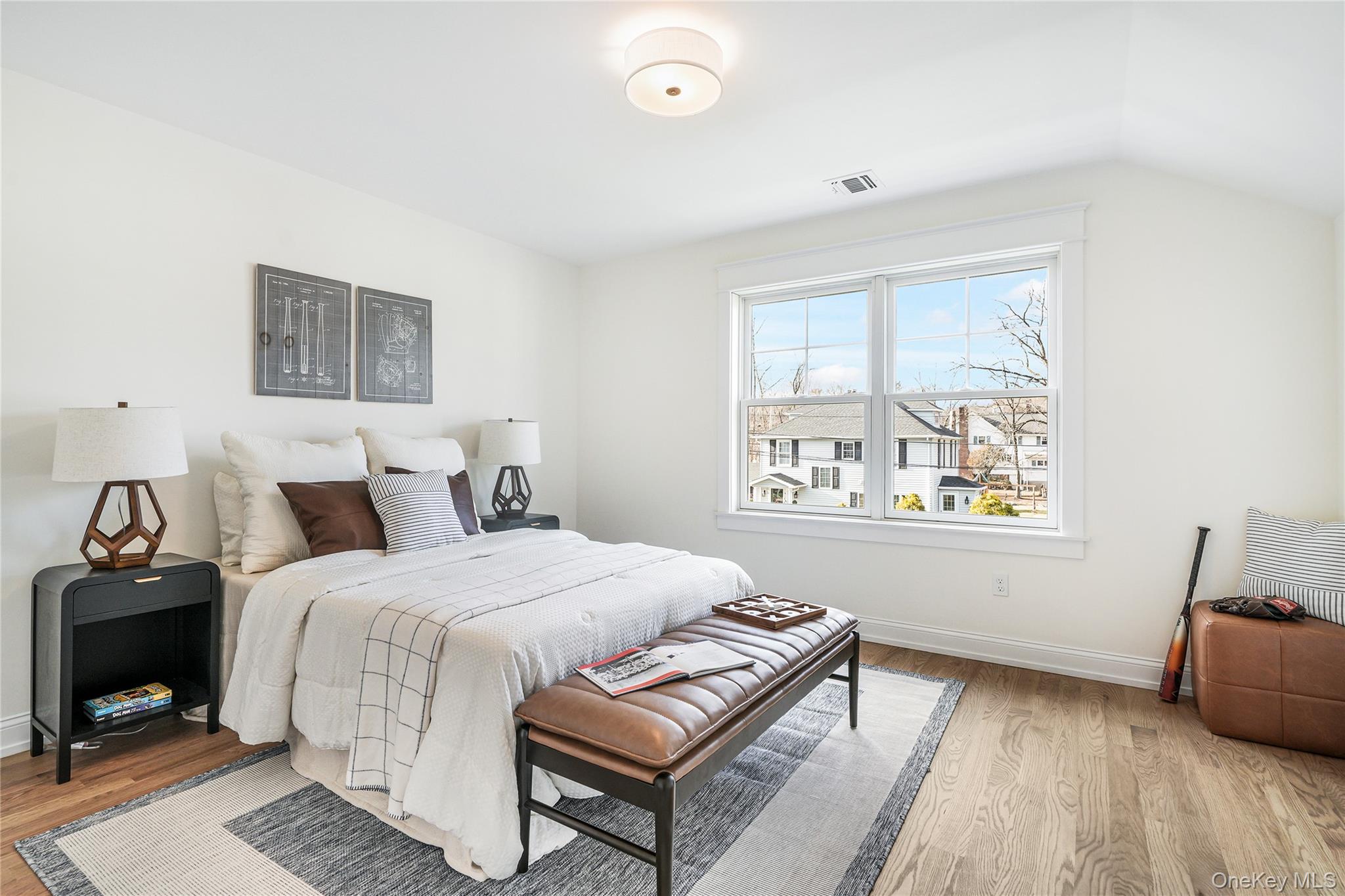 2040 Crompond Road, Unit 17 Yorktown Heights, NY 10598 - Photo 16 of 22 Bedroom featuring vaulted ceiling and light hardwood / wood-style floors