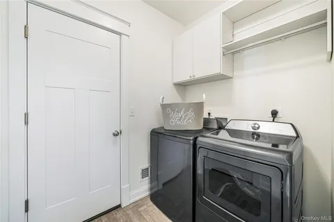 a view of storage and utility room with washer and dryer